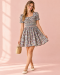 Floral cotton dress with hand smocking and ruffled collar