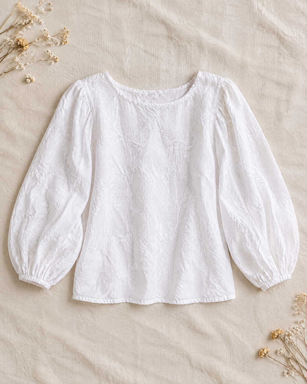 White linen blouse with long lantern sleeves